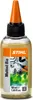 A bottle of Stihl Multioil Bio lubricant with a label showing tools and leaves. Náhľad obrázku produktu