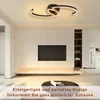 A modern living room with a TV and a stylish ceiling lamp. Náhled obrázku produktu
