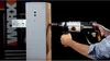 A person is using a drill to drill into a wooden post. Náhled obrázku produktu