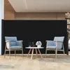 Two chairs and a table are set up in front of a large black screen, suggesting an outdoor or patio setting. Podgląd zdjęcia produktu