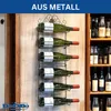 A wall-mounted wine rack holding six bottles of wine, with a shelf of wine bottles visible in the background. Produktbild-Vorschau