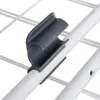 A close-up of a gray plastic clip attached to a white rod, which is part of a drying rack. Náhľad obrázku produktu