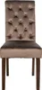 A front view of a tufted dining chair with dark wooden legs. Voir les images du produit