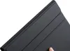 A close-up shot of a black keyboard case, with a finger visible at the bottom right. Náhled obrázku produktu