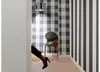 A hallway with patterned wallpaper and a chair. Produktbild-Vorschau