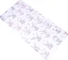 A baby crib sheet with a pattern of cartoon animals on swings. Produktbild-Vorschau