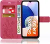 A pink flip case for a Samsung Galaxy A14 5G phone, shown open with cards and euro banknotes inserted. Produktbild-Vorschau
