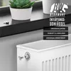 A close-up of a white radiator with a vent key attached, placed on a windowsill with a plant and a white pot. Anteprima dell’immagine prodotto
