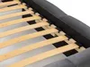 Close-up view of the wooden slats and upholstered frame of a bed. Náhled obrázku produktu