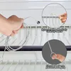A hand holding a cleaning tool with a close-up inset showing its bristles and another inset showing the circular design of the handle. Produktbild-Vorschau