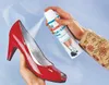 A person is spraying a red high-heeled shoe with a foot and shoe deodorant spray. Náhled obrázku produktu