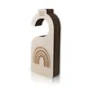 A wooden baby size divider with a rainbow design and the number 50 engraved on it, presented on a white background. Produktbild-Vorschau