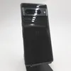 A black Google Pixel 7 Pro smartphone is displayed on a stand against a white background. Podgląd zdjęcia produktu