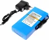 A blue rechargeable battery pack with a black charger and cable on a white background. Produktbild-Vorschau