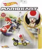 Hot Wheels Mario Kart Toad toy car in its packaging, with other Mario Kart characters in the background. Náhled obrázku produktu