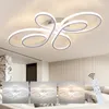 A modern LED ceiling light with a unique, swirling design is shown mounted on a ceiling. Below the main image, three smaller inset images display the light with different color temperatures, and a remote control is shown with a Wi-Fi symbol. Podgląd zdjęcia produktu