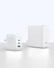 Two white power adapters are displayed on a light gray surface against a white background. Produktbild-Vorschau