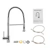A kitchen faucet and its accessories are laid out on a white background, along with an instruction manual. Produktbild-Vorschau