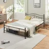 A bedroom scene with a bed, dresser, and window. Voir les images du produit