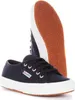 A pair of navy blue Superga sneakers with white soles and laces, shown from a slightly angled front view. One shoe is in focus in the foreground, and the sole of another shoe is visible behind it. Produktbild-Vorschau