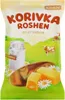 A bag of Korivka Roshen milky sweets with a rural landscape background. Podgląd zdjęcia produktu