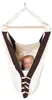 A baby sleeping in a hanging hammock. Podgląd zdjęcia produktu
