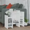 A white shelving unit is placed next to a sofa, with books and decorative items on the shelves. Anteprima dell’immagine prodotto