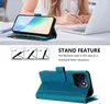 A person is using a phone with a teal case while working at a desk with a laptop. Produktbild-Vorschau