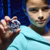 A child holding a Beyblade toy. Anteprima dell’immagine prodotto