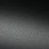 A close-up, textured view of a black object, likely a product surface. Produktbild-Vorschau