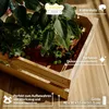 A wooden crate with plants inside, placed on a wooden surface. Text overlays describe features and dimensions. Produktbild-Vorschau