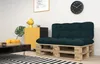 A living room scene with a pallet sofa, coffee table, and side table. Voir les images du produit