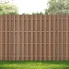 A brown WPC fence with green grass in the foreground and trees in the background. Anteprima dell’immagine prodotto