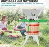 Two people in a garden with an apple press and fruit. Produktbild-Vorschau