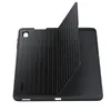 A black tablet case is shown from a slightly elevated angle, with the cover open and propped up. Produktbild-Vorschau