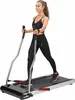 A woman is using a treadmill for Nordic walking. Voir les images du produit