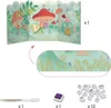 A collection of items for a craft kit, including a pop-up scene, stamps, ink pad, and pen. Produktbild-Vorschau