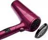 A close-up studio shot of a purple Revlon hair dryer with a black nozzle attachment next to it. Produktbild-Vorschau