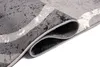 A close-up view of a rolled-up rug, showing its texture and pattern. Produktbild-Vorschau