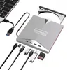 A silver DVD drive and USB hub with various cables and memory cards, connected to a laptop. Produktbild-Vorschau