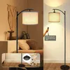 A collage showing a floor lamp in a bedroom setting and a close-up of a remote control with text overlay. Voir les images du produit
