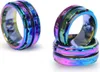 Two views of a rainbow-colored spinner ring with numbers on it, set against a white background. Produktbild-Vorschau