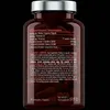 A close-up of a bottle of L-Carnitine capsules against a black background, showing the nutritional information and ingredients. Podgląd zdjęcia produktu