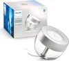 A product shot of a Philips Hue Iris table lamp and its packaging. Produktbild-Vorschau