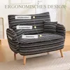 A black and white striped armchair with text overlays highlighting ergonomic features. Náhled obrázku produktu