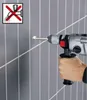 A hand is holding a Bosch drill, about to drill into a tiled wall. A warning symbol is in the top left corner. Anteprima dell’immagine prodotto