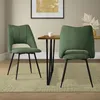 Two green dining chairs are placed around a wooden dining table in a room. Náhľad obrázku produktu