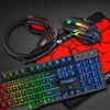 A gaming keyboard, mouse, and headset are arranged on a red and black patterned surface. Voir les images du produit