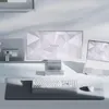 A clean, minimalist desk setup featuring Razer products, including a monitor, laptop, keyboard, mouse, and a large mousepad. Anteprima dell’immagine prodotto