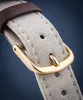 Close-up of a watch strap buckle. Voir les images du produit